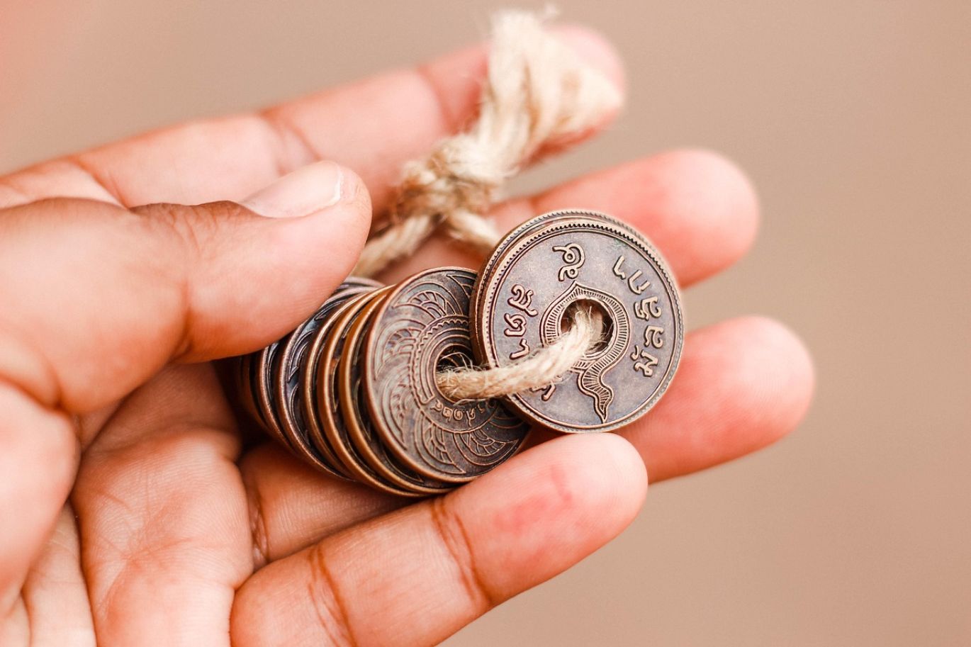 Gold coins being valued by a professional at Summit Gold Resources, the best place to sell gold coins in Kenya.