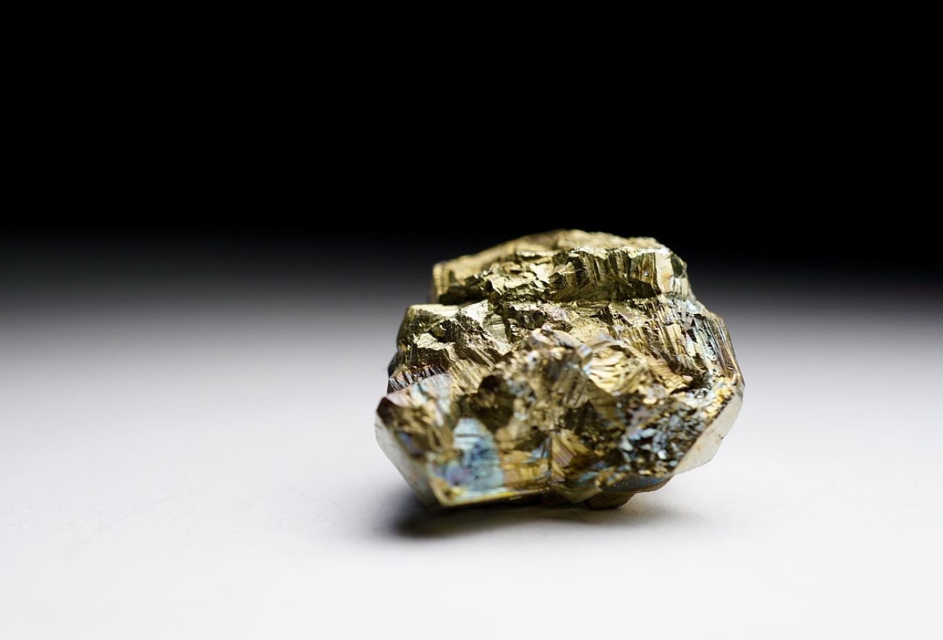 Display of gold, silver, and platinum bars representing Bloomberg Precious Metals, signifying investment and industrial