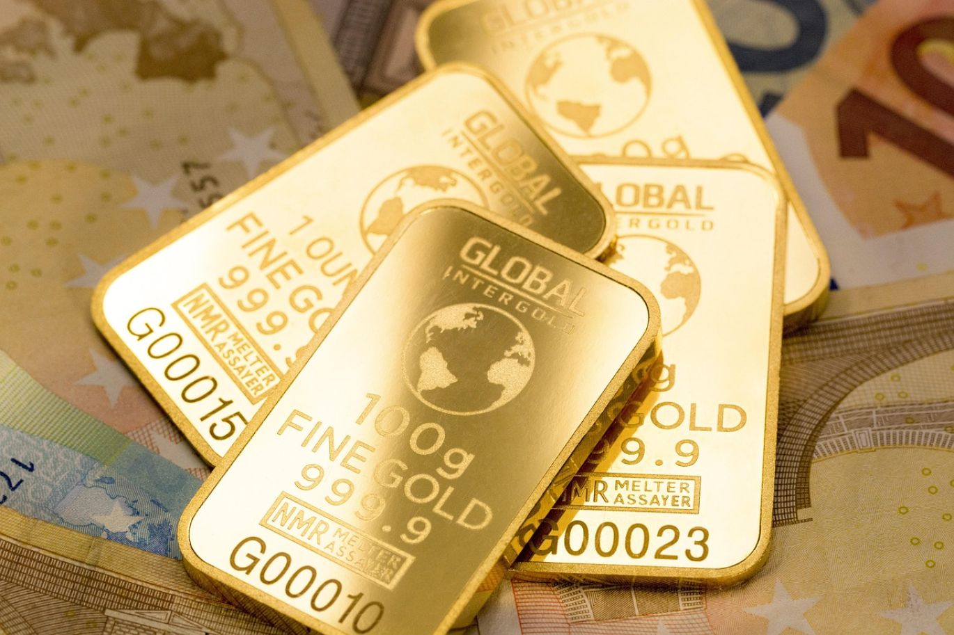 Close-up of certified gold bars with Summit Gold Resources branding