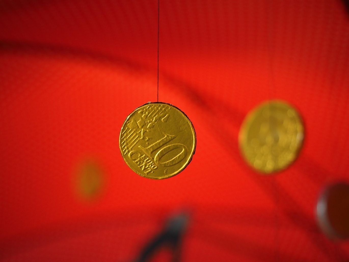 Close-up of Canadian Mint Gold coins, symbolizing purity and value.