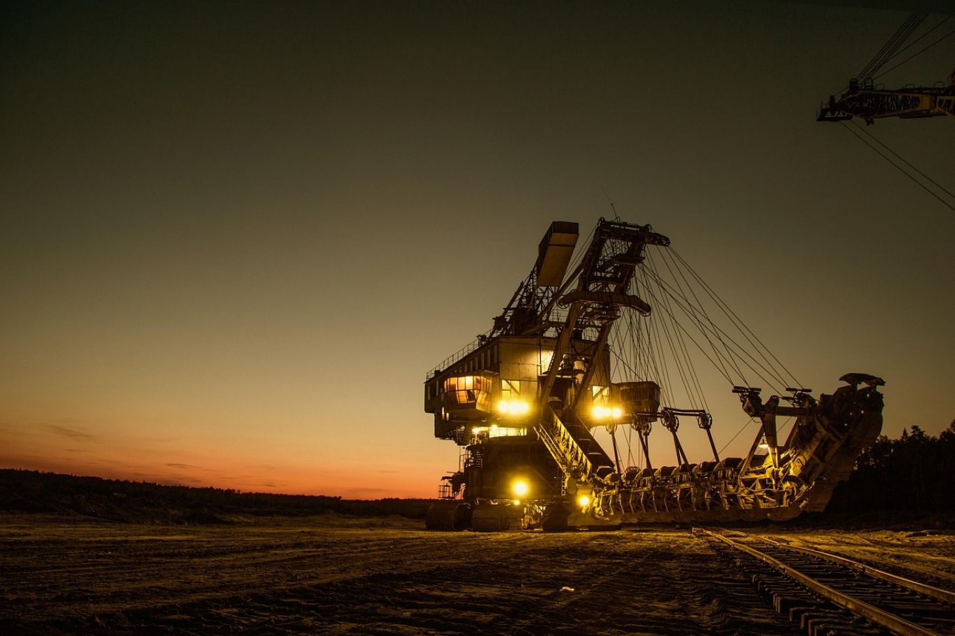 Workers and machinery involved in Cell Mining operations for essential battery minerals