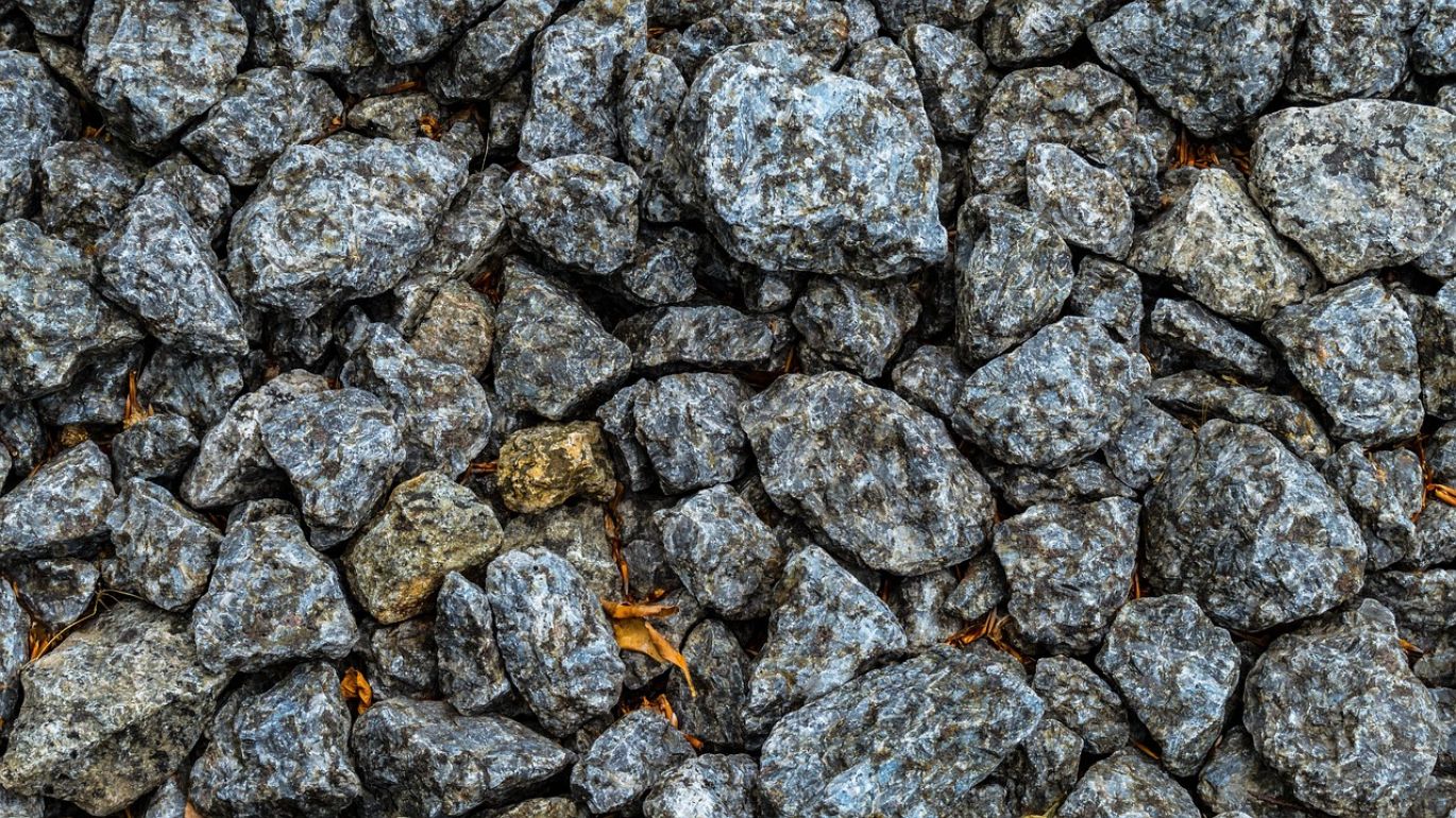 Investor examining copper stocks with dividends, highlighting Summit Gold Resources's ethical copper cathode supply from Kenya.