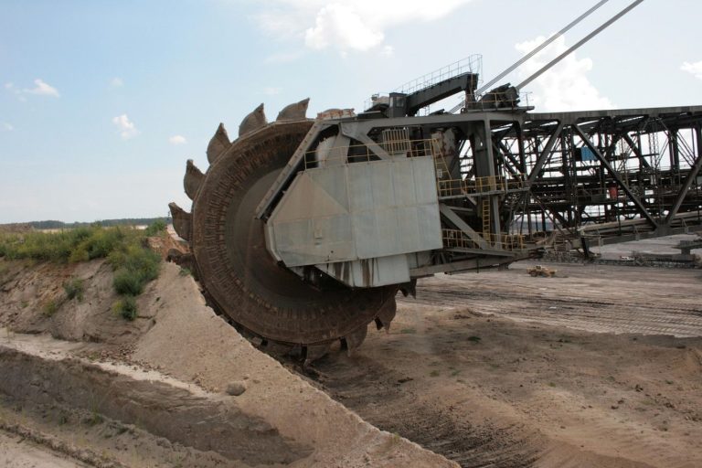 Large dragline excavator performing earthmoving operations in a Kenyan mine for mineral extraction.