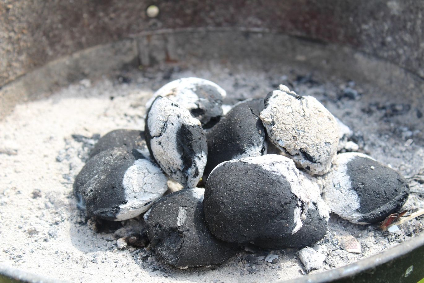 Pile of high-quality Fluorspar Briquettes ready for industrial use, supplied by Summit Gold Resources.