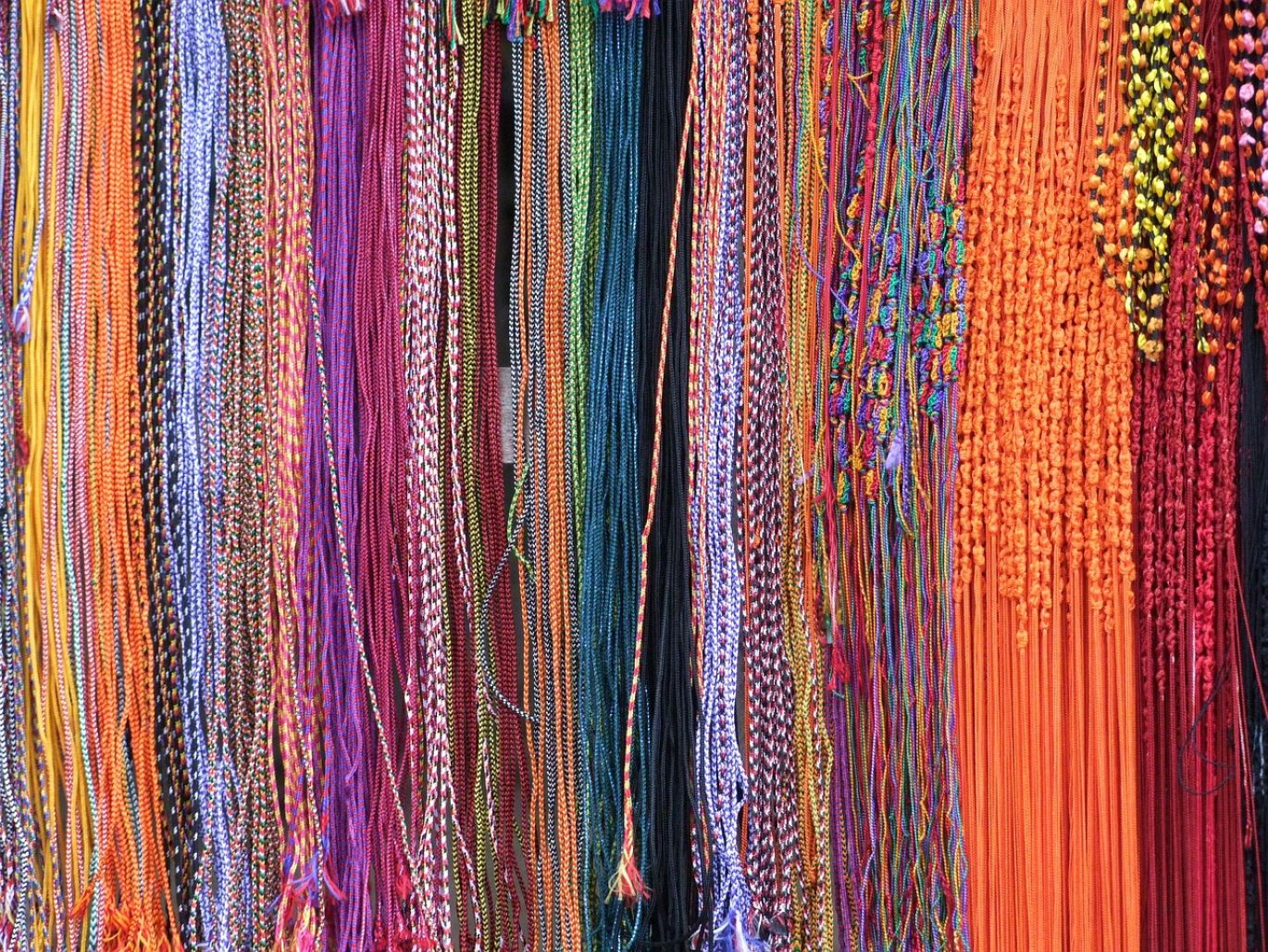 Close-up of various gemstone beads for wholesale supply from Kenya, offered by Summit Gold Resources.