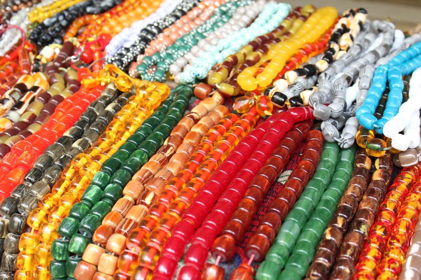A large collection of assorted Healing Stone Beads Bulk, showcasing various colors and textures.