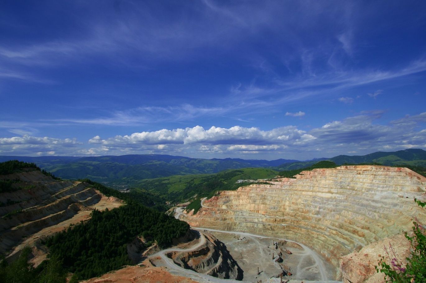 A large open-cast mining pit in Kenya, showcasing the extraction of valuable minerals for global industrial use.