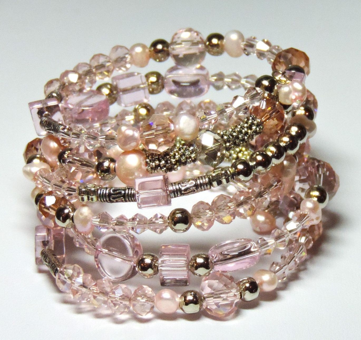 A selection of natural crystal beads in various colors and shapes, offered for wholesale by Summit Gold Resources in Kenya.