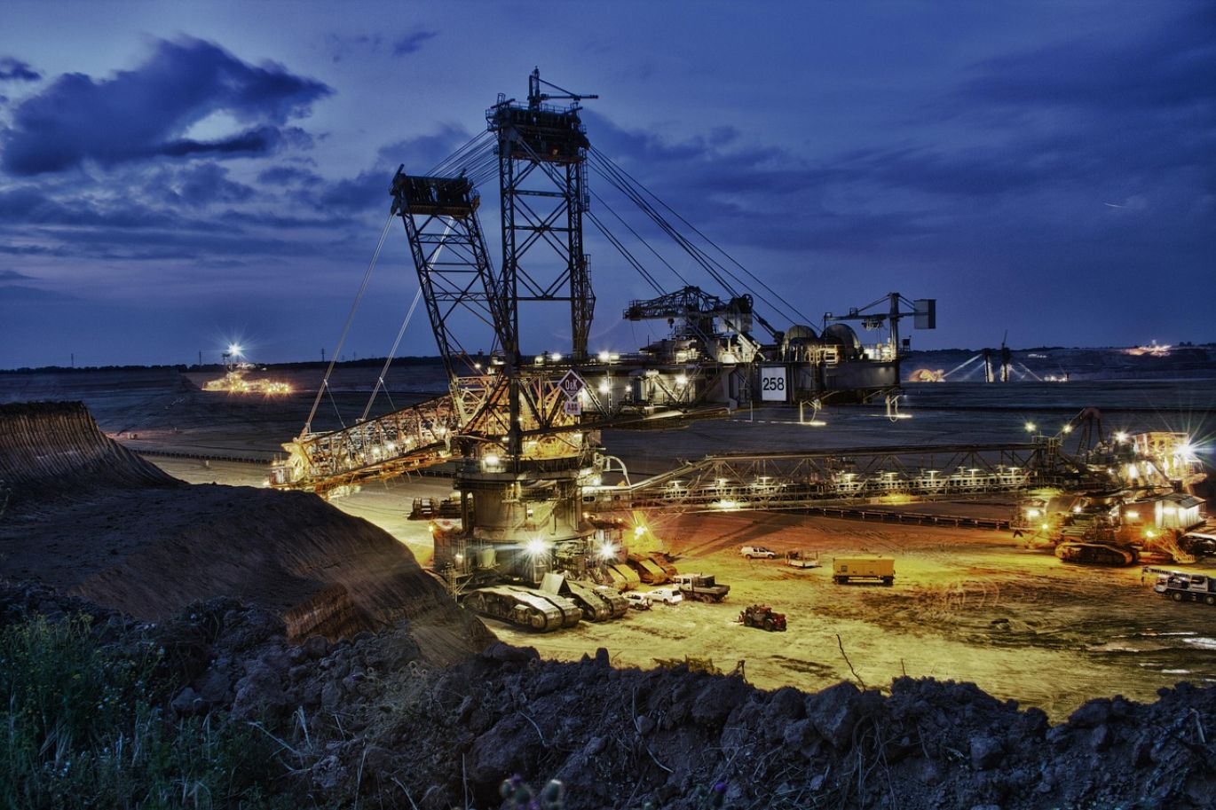Aerial view of an open pit gold mine in Kenya, highlighting large-scale extraction operations managed by Summit Gold Resources.