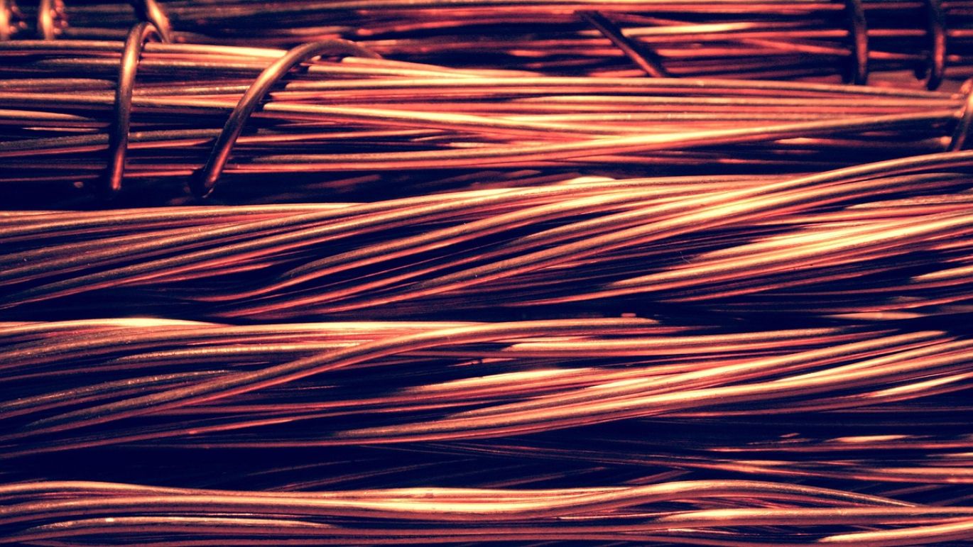 Close-up of shiny pure copper cathode ingots stacked, representing high-quality industrial metal sourced from Kenya.