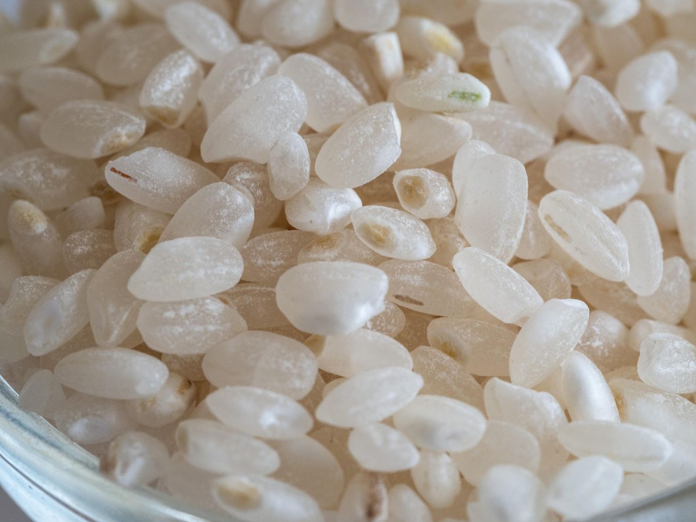 Close-up of various real crystals in bulk, showcasing different colors and formations, offered by Summit Gold Resources.