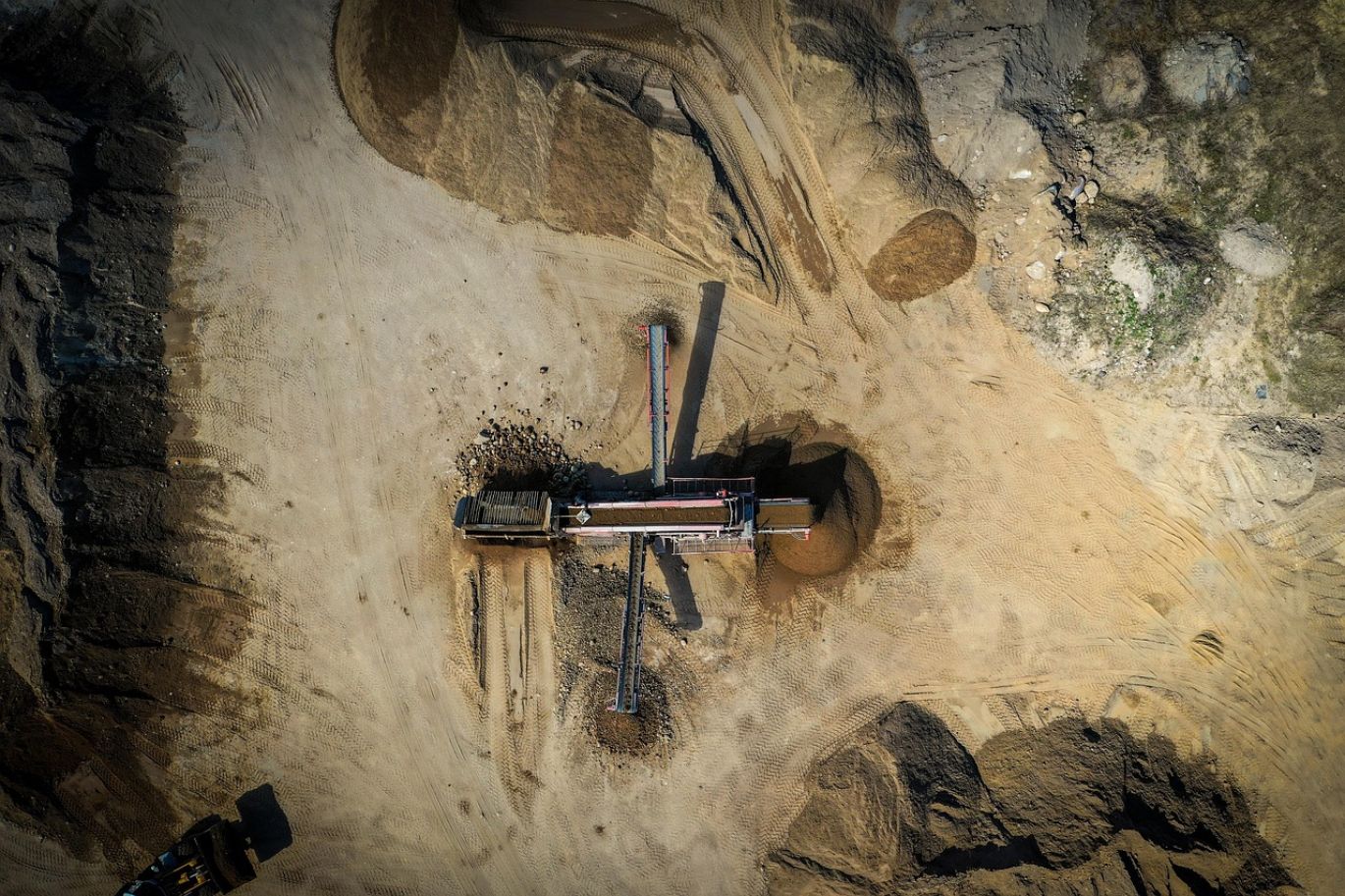 A view of a Sand And Gravel Mine in Kenya, showcasing material extraction and processing by Summit Gold Resources for construction.