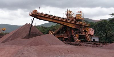 Tamarack mining site in Kenya with industrial equipment and team members overseeing operations.