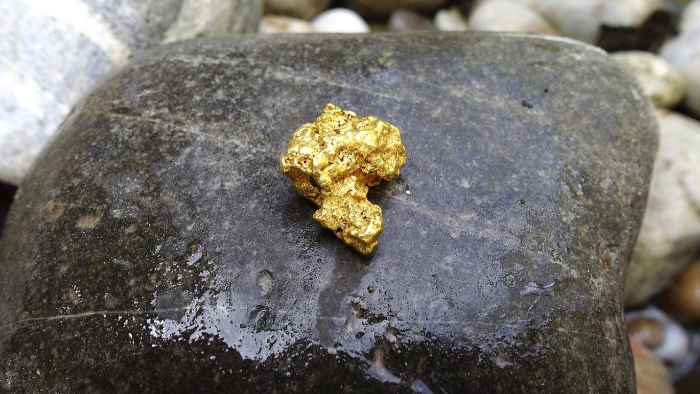 The Royal Mint Bullion: Stack of gold bars representing a secure investment.